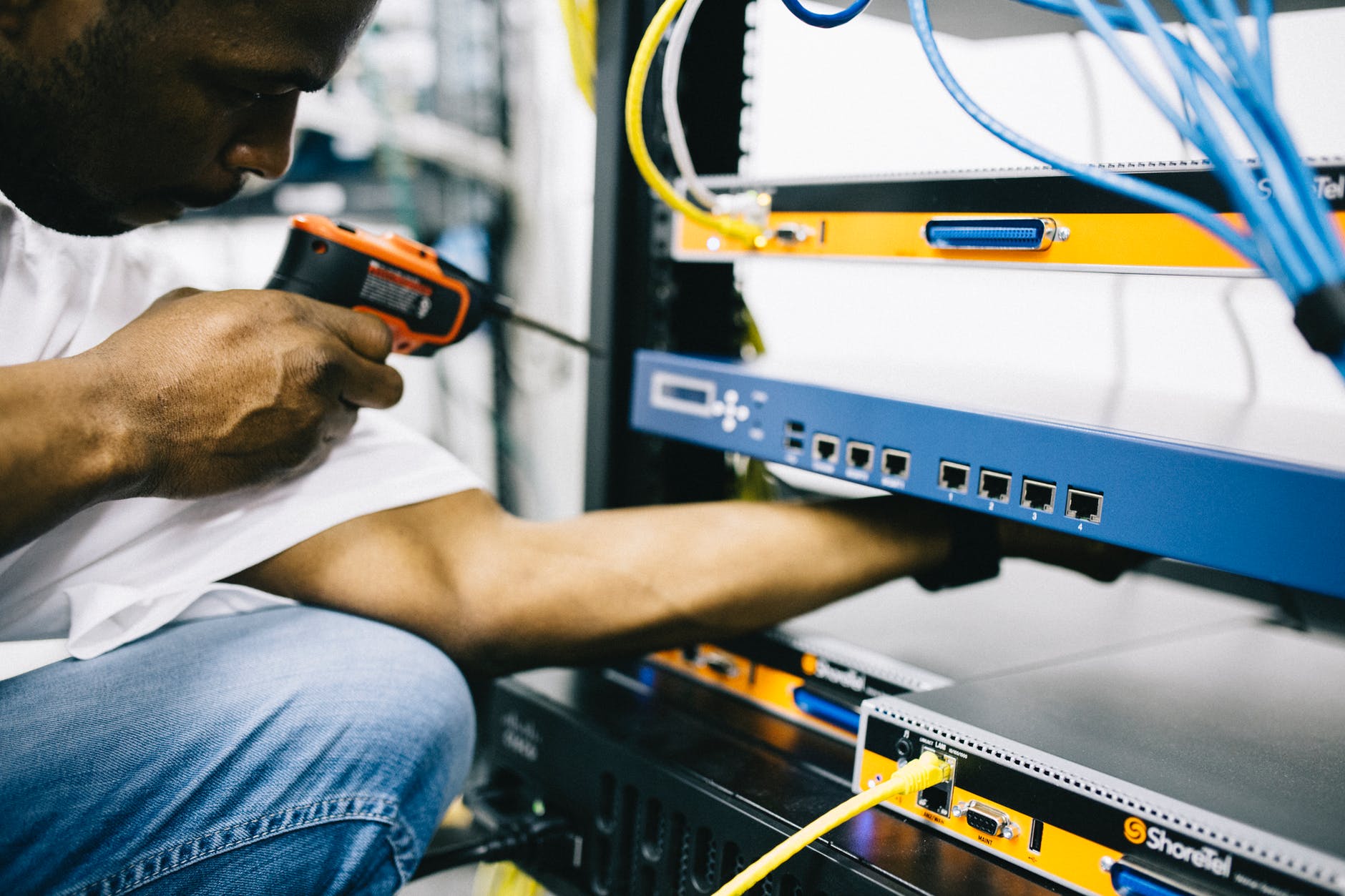 System engineer maintaining the server racks 